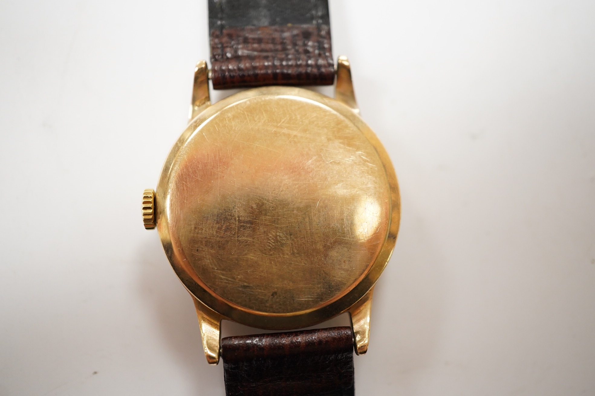 A gentleman's 9ct gold Ernest Borel manual wind wrist watch, with baton numerals and date aperture, case diameter 31mm, on a leather strap. Condition - fair